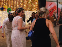a group of people dancing in a warehouse