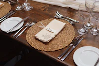 a table setting with a napkin and silverware