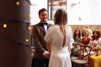 a bride and groom exchange vows at a wedding ceremony